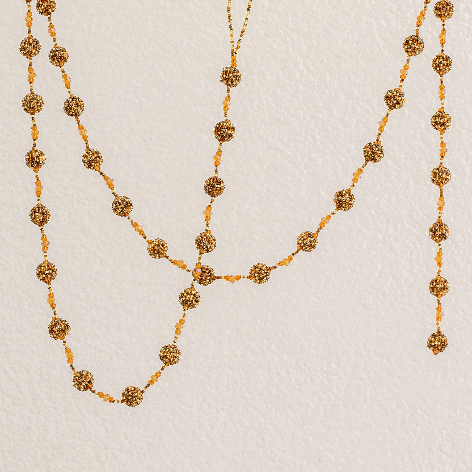 Glass Beaded Garland in Orange - Golden Silhouettes